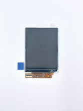 Load image into Gallery viewer, Gray LCD display module with copper circuit board connector and blue adhesive tape on white background.
